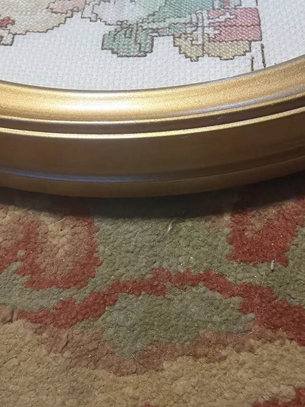 Gold Oval Framed Cross Stitch Artwork - 'Love is Kind'